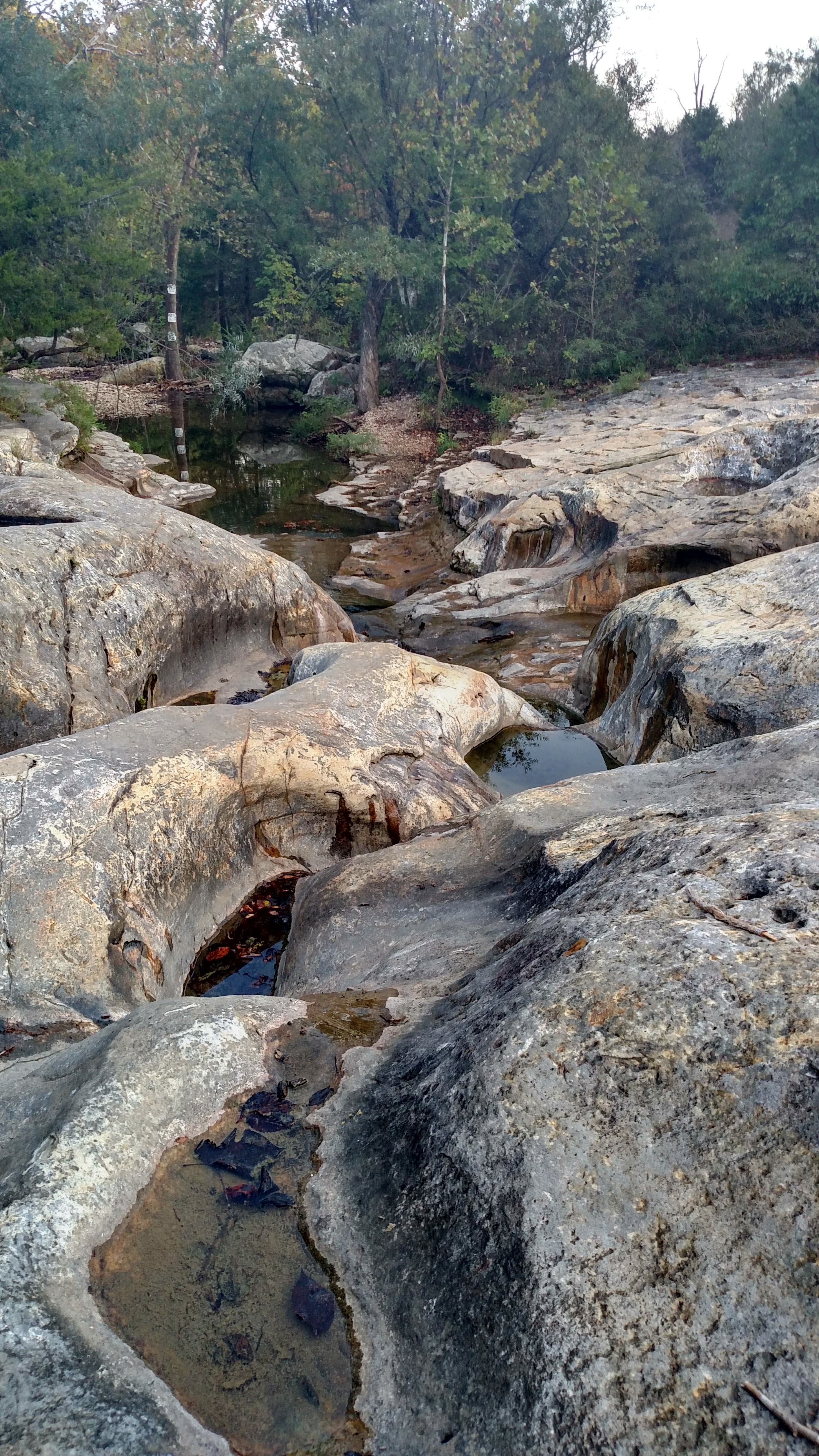 stream through heavily eroded rocks